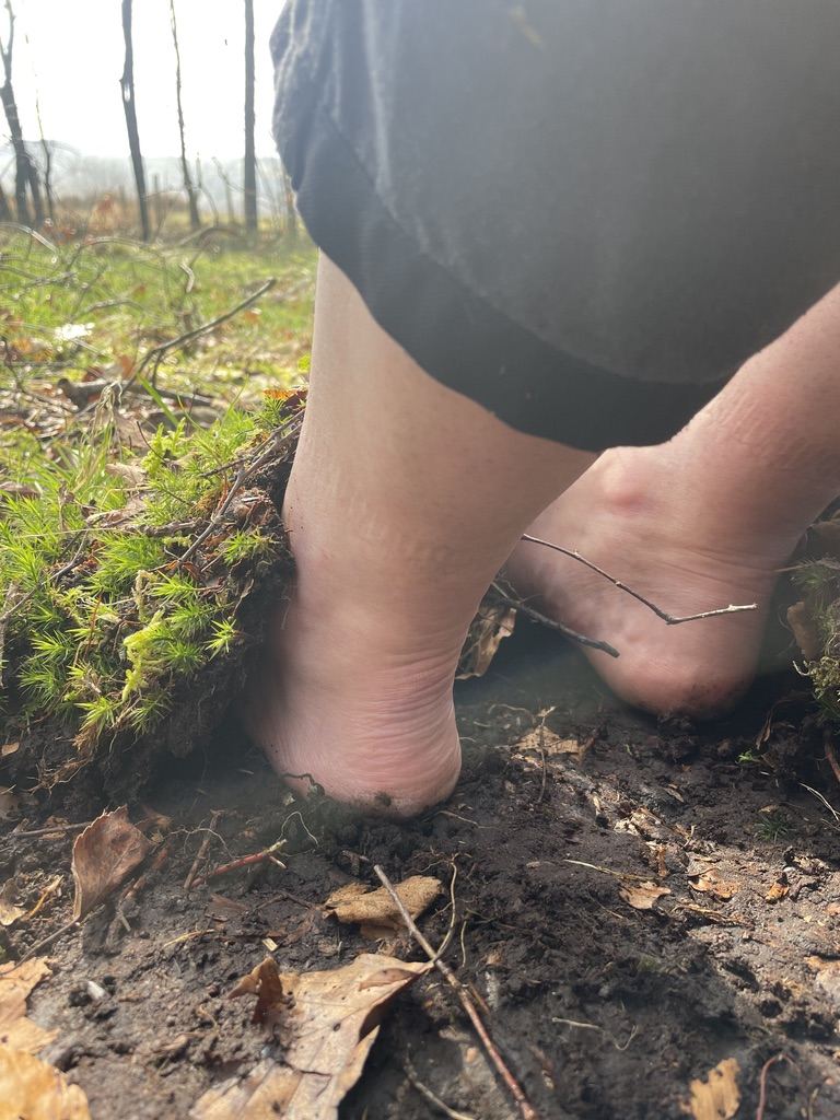 Bare feet meeting the soil of Hensol Wood