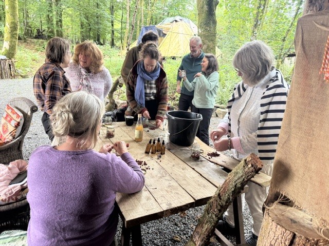People making together at the woodland table